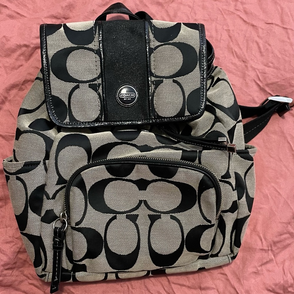 Black and tan coach backpack